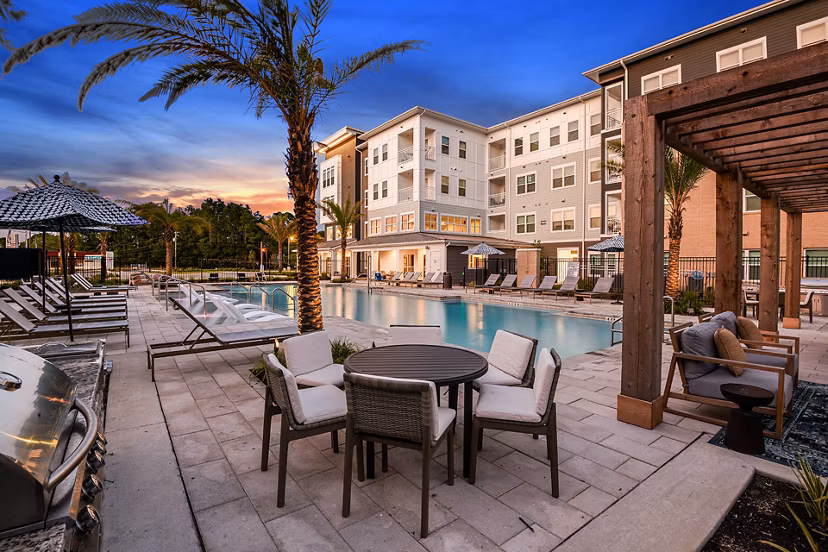 Patio with cozy seating and garden views at Renaissance Santa Rosa Apartments