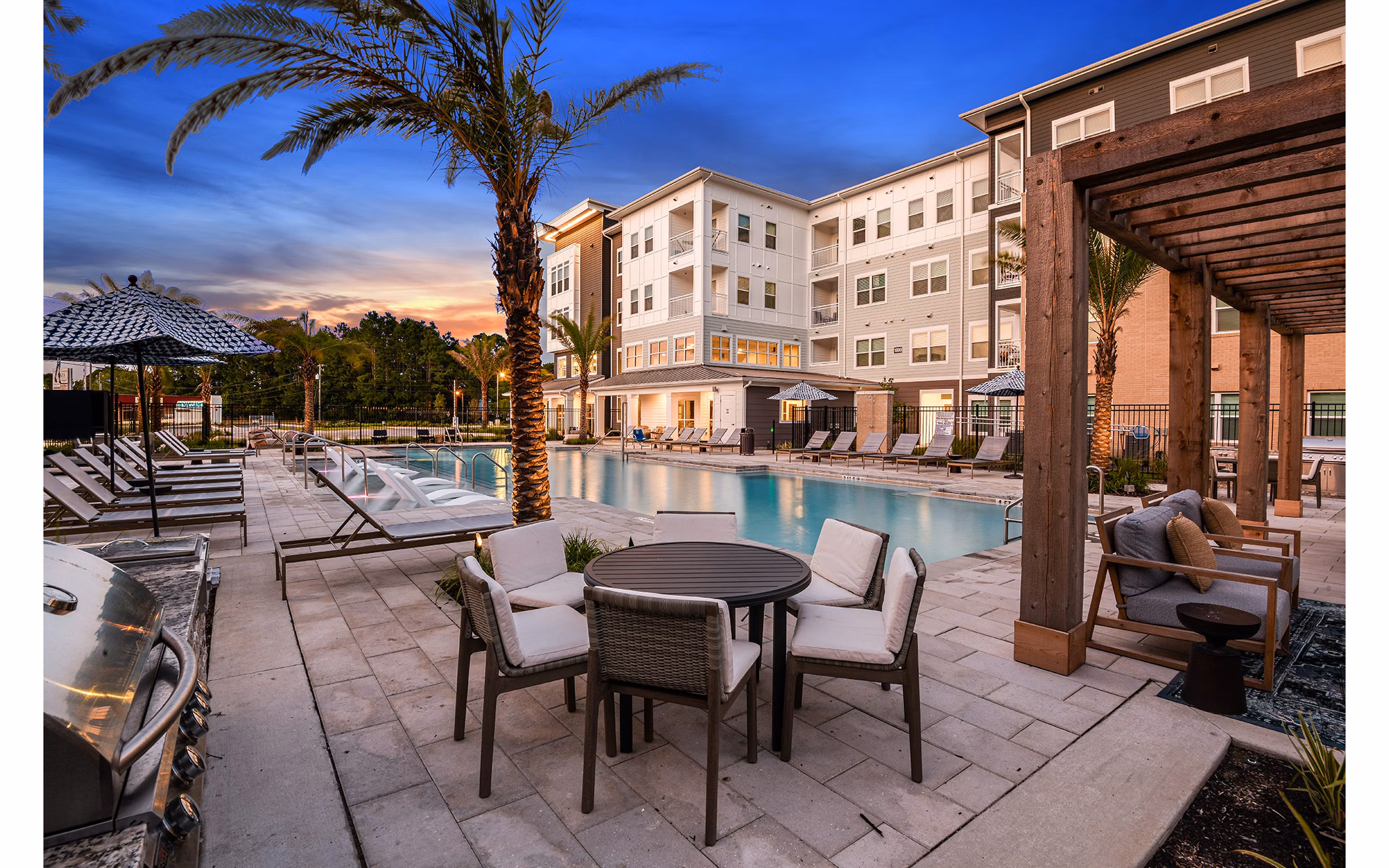 Patio with cozy seating and garden views at Renaissance Santa Rosa Apartments