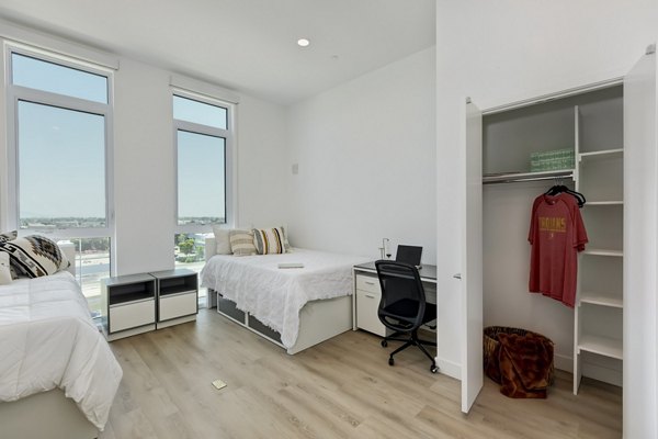 Cozy bedroom with modern furnishings at The 505 Apartments in Nashville