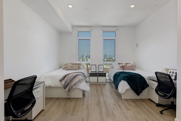 Modern bedroom with city view at The 505 Apartments