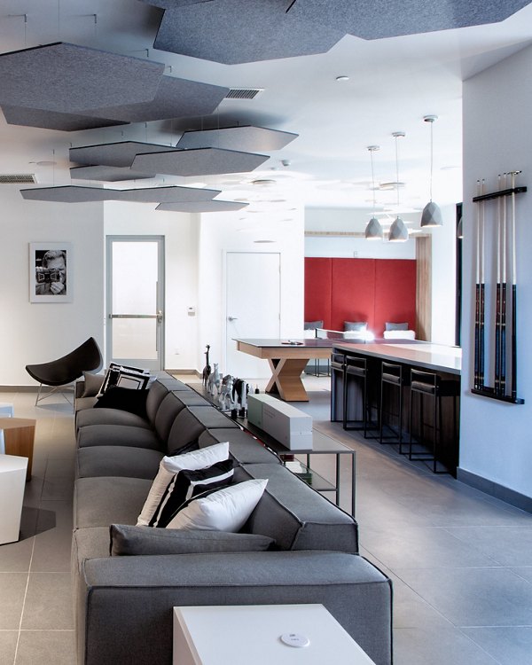 The 505 Apartments: Modern clubhouse featuring stylish decor and comfortable seating areas in Greystar luxury apartments