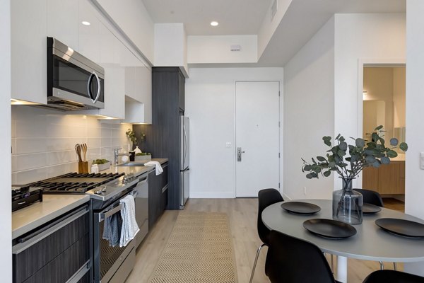 Dining area with modern decor and elegant lighting at The 505 Apartments, a luxury property by Greystar