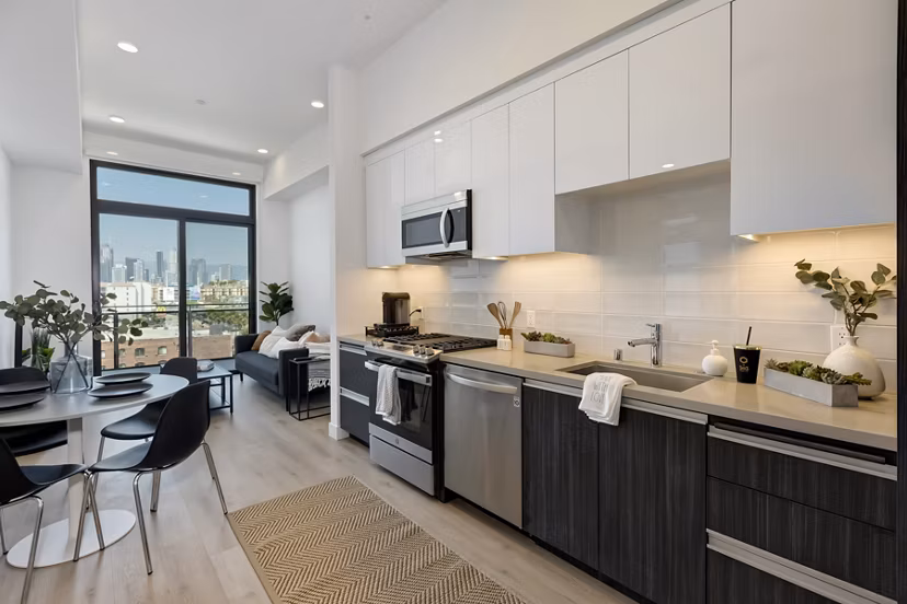 Modern kitchen with stainless steel appliances at The 505 Apartments, luxury living spaces designed for style and functionality