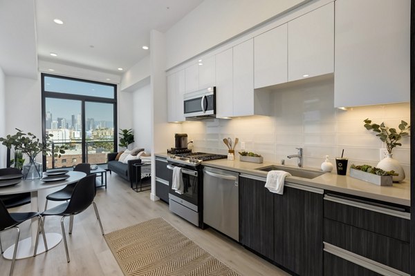 Modern kitchen with stainless steel appliances at The 505 Apartments, luxury living spaces designed for style and functionality