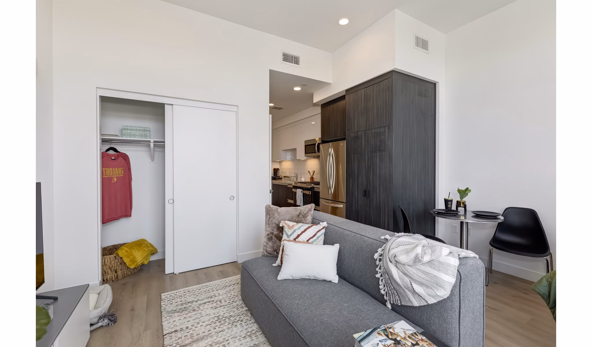 Spacious living room with modern decor and large windows in The 505 Apartments