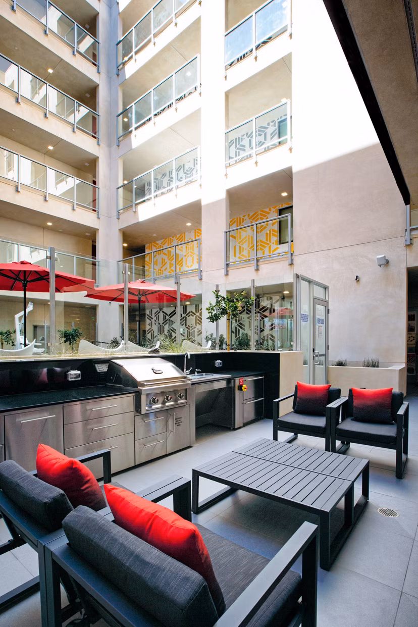 Grill area with modern barbecue stations at The 505 Apartments, offering a luxury outdoor experience for residents enjoying outdoor dining