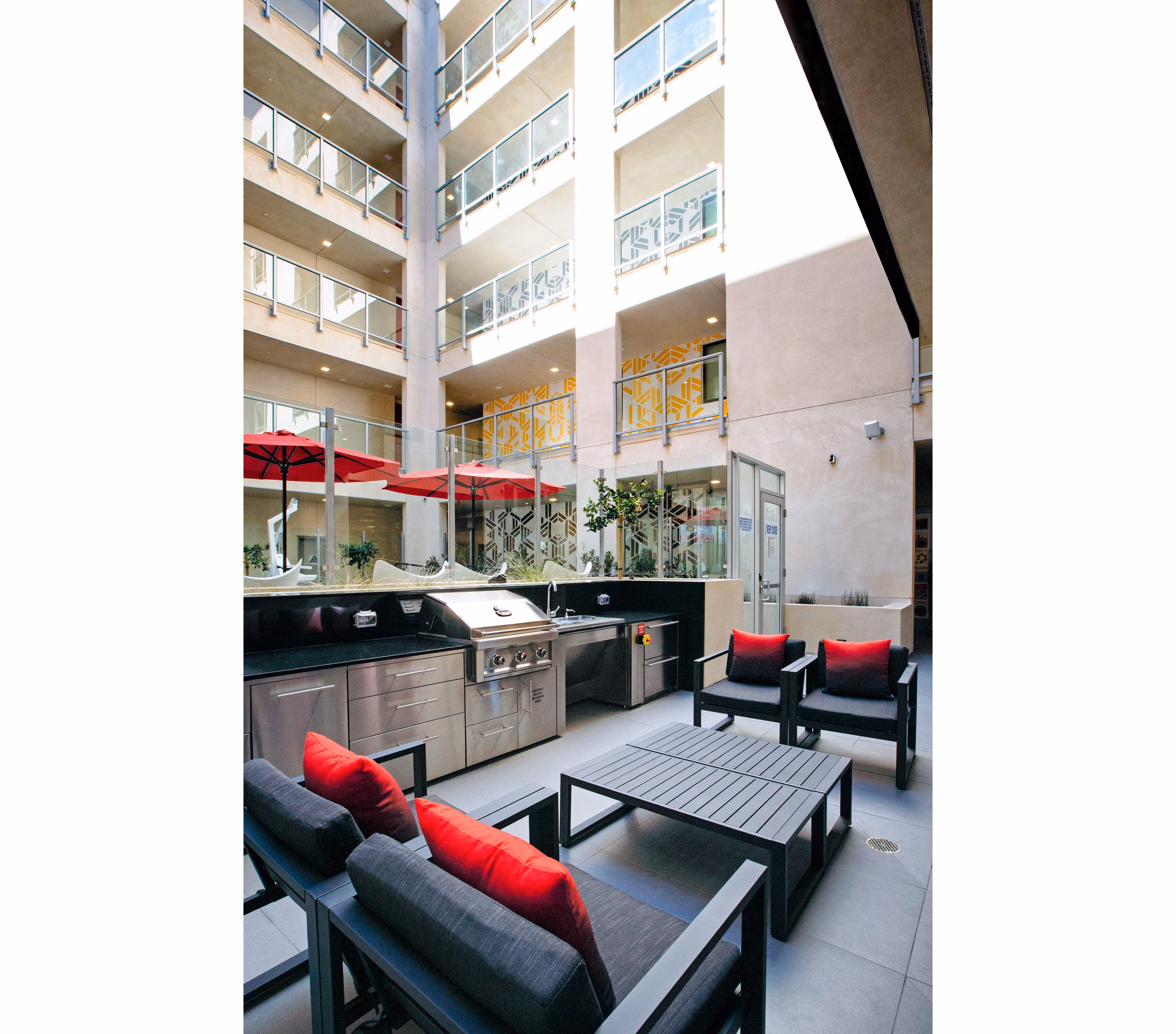 Grill area with modern barbecue stations at The 505 Apartments, offering a luxury outdoor experience for residents enjoying outdoor dining