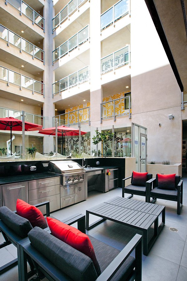 Grill area with modern barbecue stations at The 505 Apartments, offering a luxury outdoor experience for residents enjoying outdoor dining
