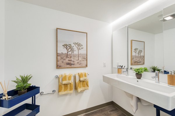 Bathroom with sleek fixtures and modern design at The Durant Apartments