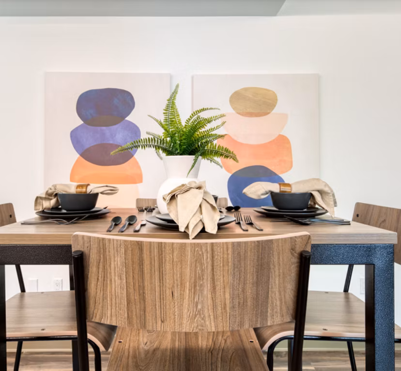 Dining area with elegant lighting and modern furnishings at The Durant Apartments, luxurious high-rise living
