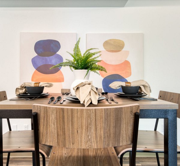 Dining area with elegant lighting and modern furnishings at The Durant Apartments, luxurious high-rise living