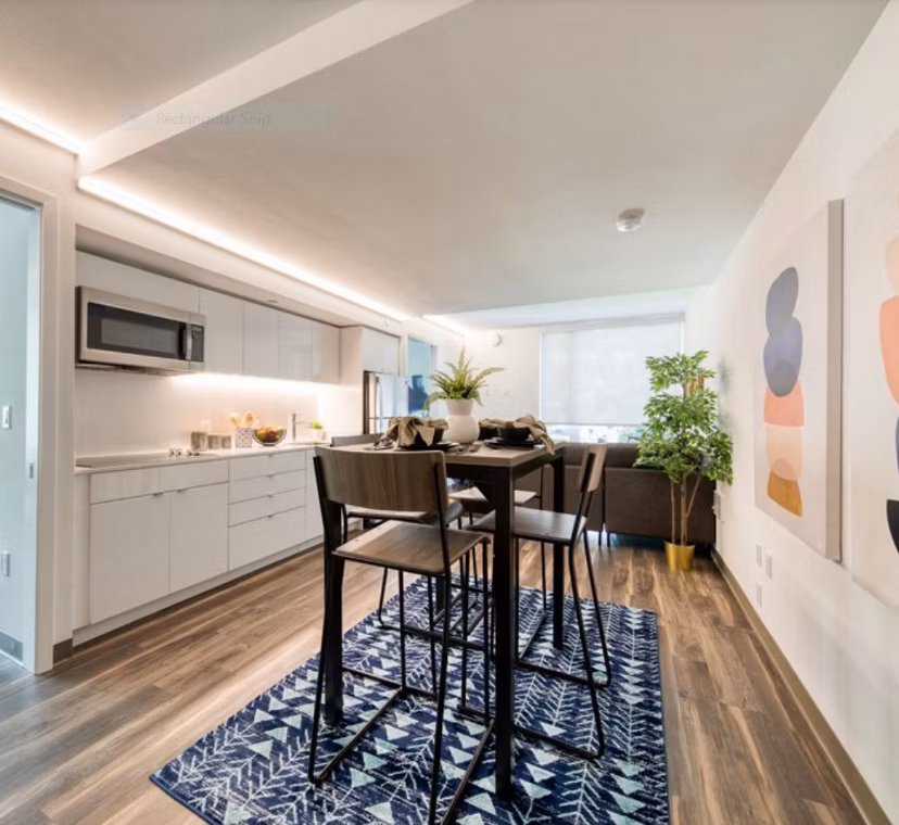 Dining area featuring modern decor and elegant lighting at The Durant Apartments in a luxury setting