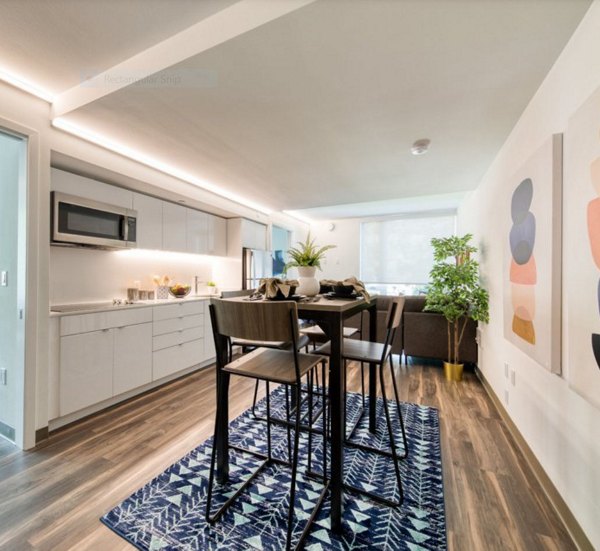 Dining area featuring modern decor and elegant lighting at The Durant Apartments in a luxury setting