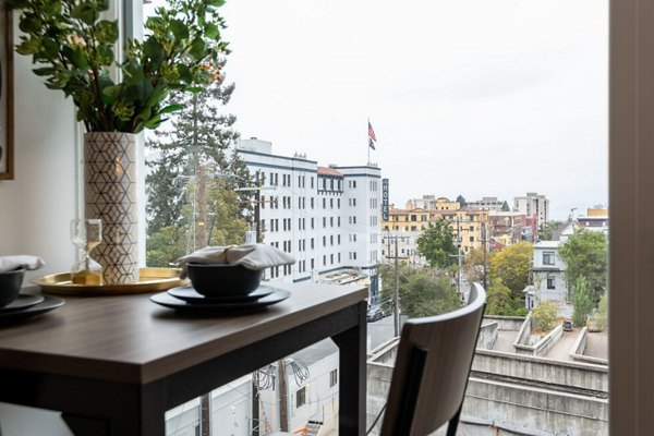 Dining area with modern furnishings at The Durant Apartments, a luxury Greystar community in an elegant setting