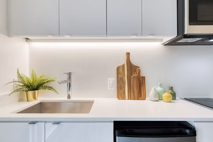 Kitchens at The Durant Apartments: Modern kitchen design with sleek countertops and stainless steel appliances in Greystar luxury apartments
