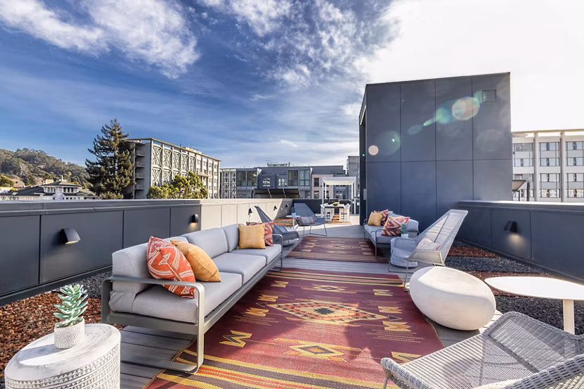 Picture-perfect rooftop deck with stylish seating at The Durant Apartments offering luxury living and skyline views