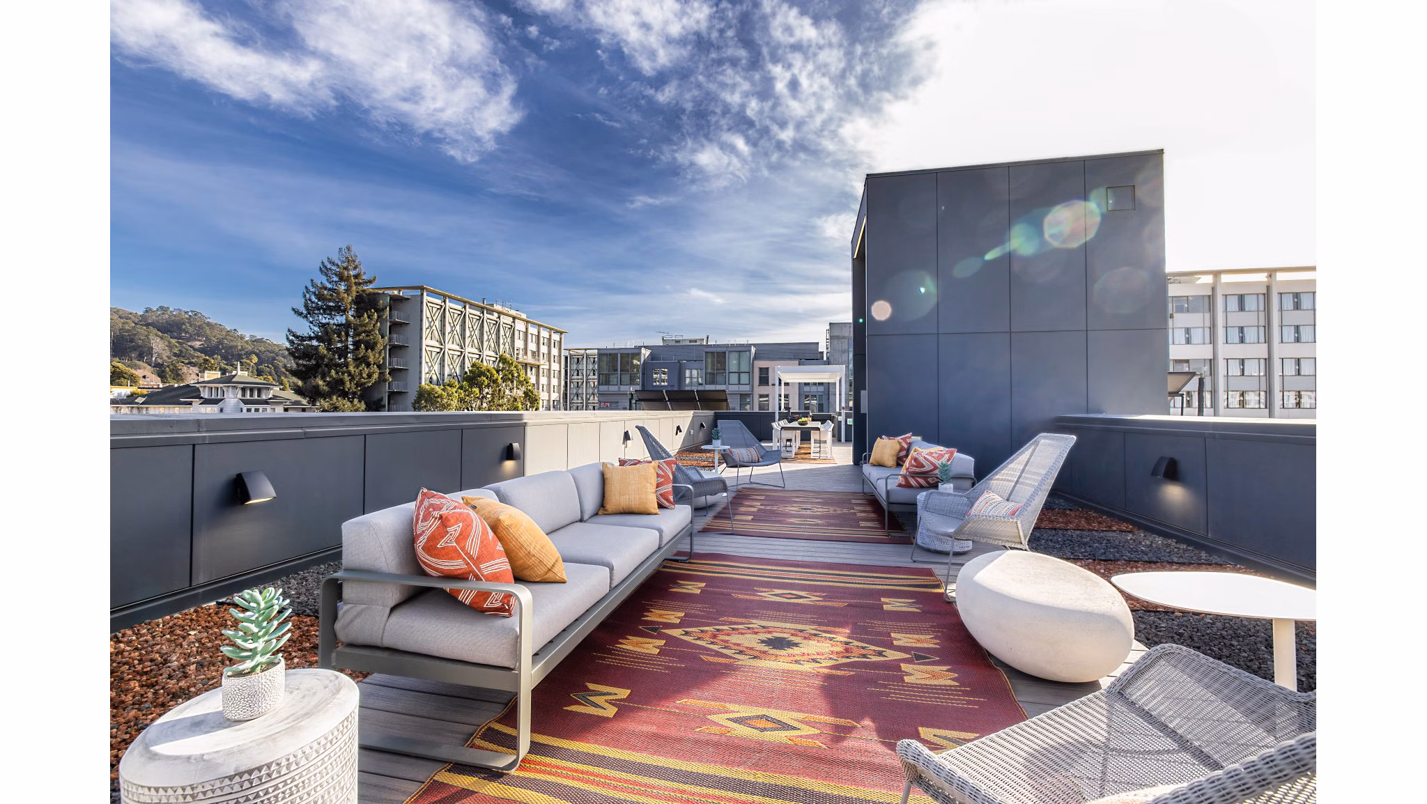 Picture-perfect rooftop deck with stylish seating at The Durant Apartments offering luxury living and skyline views