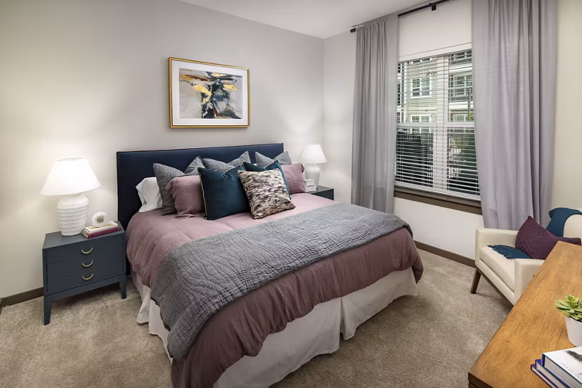 Cozy bedroom with stylish furnishings at Everleigh Duluth Apartments
