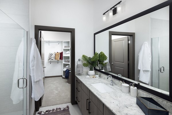 Luxurious bathroom with modern fixtures at Everleigh Duluth Apartments