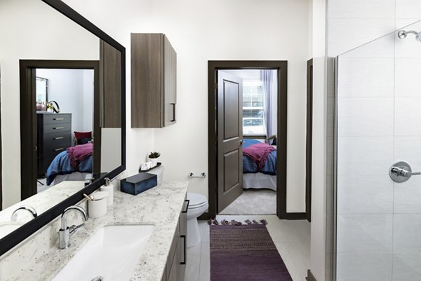Bathroom featuring elegant fixtures and modern design at Everleigh Duluth Apartments