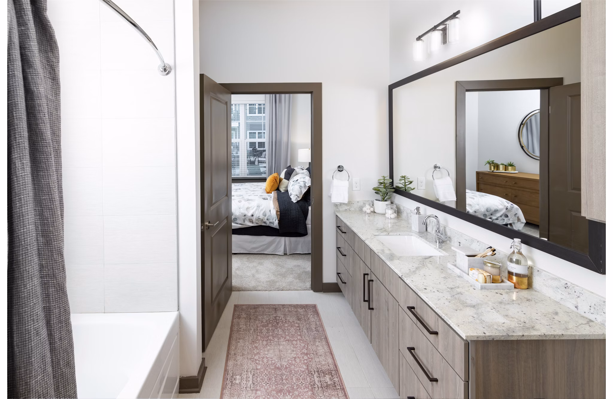Everleigh Duluth Apartments: Modern bathroom featuring sleek fixtures and spacious vanity