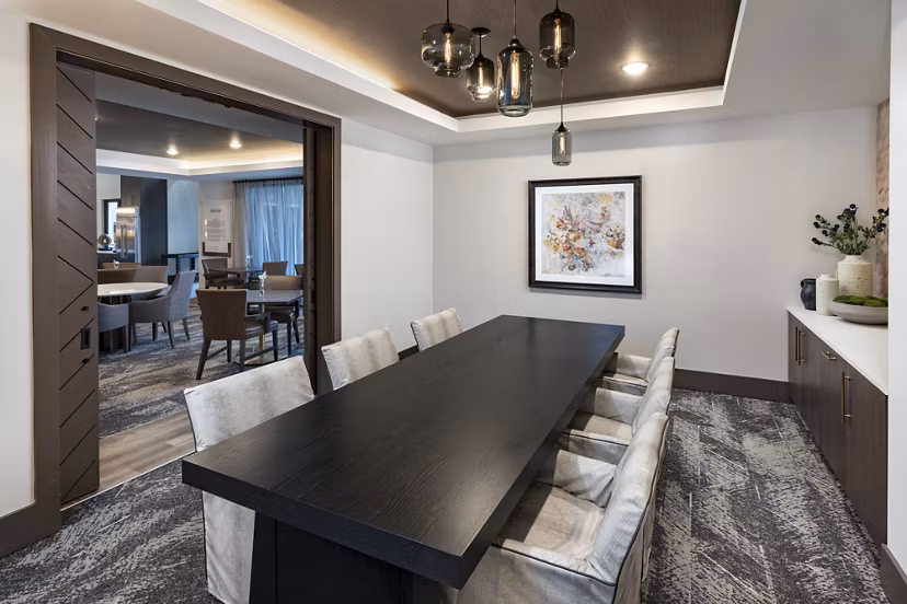 Meeting facility with modern design and seating at Everleigh Duluth Apartments caters to resident gatherings and events