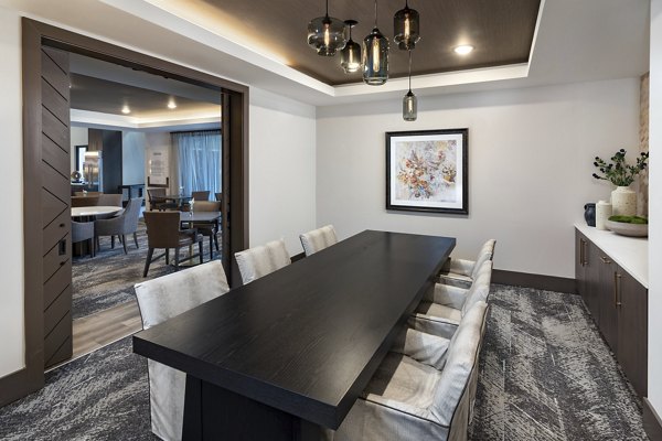 Meeting facility with modern design and seating at Everleigh Duluth Apartments caters to resident gatherings and events