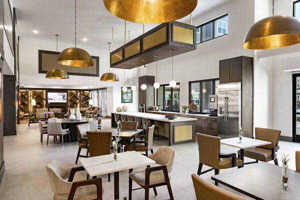 Clubhouse at Everleigh Duluth Apartments: Stylish entertainment space with modern decor and cozy seating areas for residents to enjoy