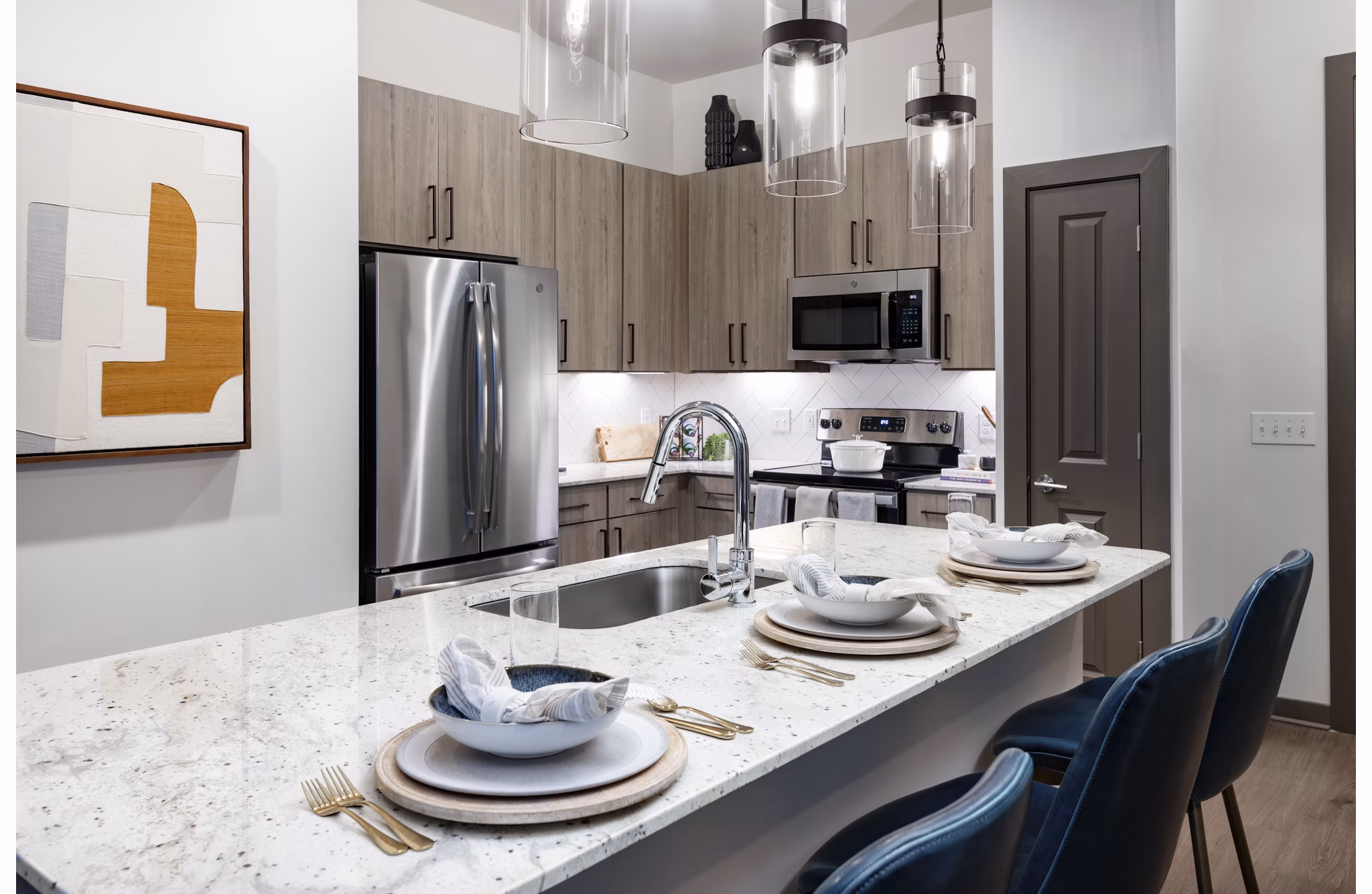 Modern kitchen with stainless steel appliances at Everleigh Duluth Apartments