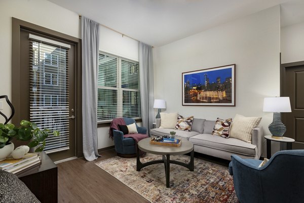 Spacious living room with modern decor in Everleigh Duluth Apartments