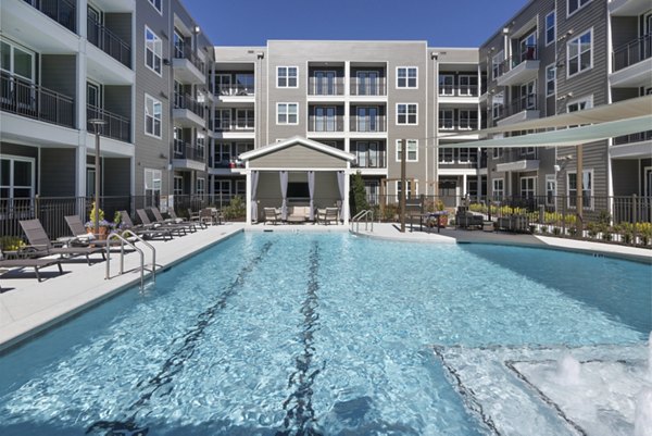 Luxurious outdoor pool at Everleigh Duluth Apartments offering comfort and elegance in a vibrant community setting