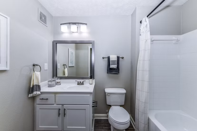 Modern bathroom featuring marble countertops and elegant fixtures at Avana Acworth apartments