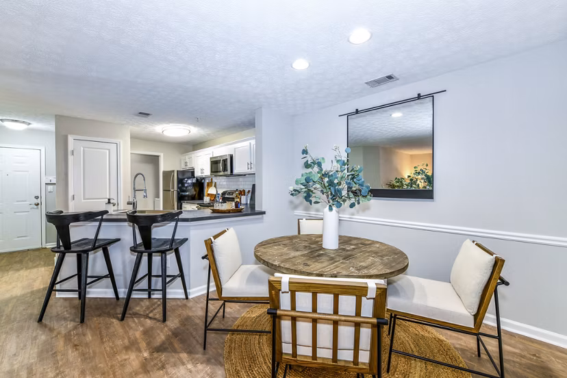Dining room featuring elegant lighting and modern decor at Avana Acworth Apartments
