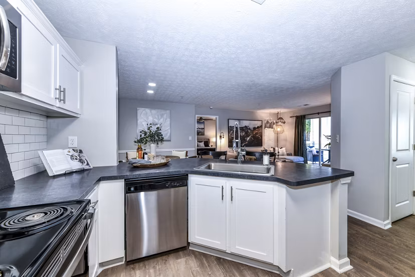 Modern kitchen with sleek cabinetry and stainless steel appliances at Avana Acworth Apartments