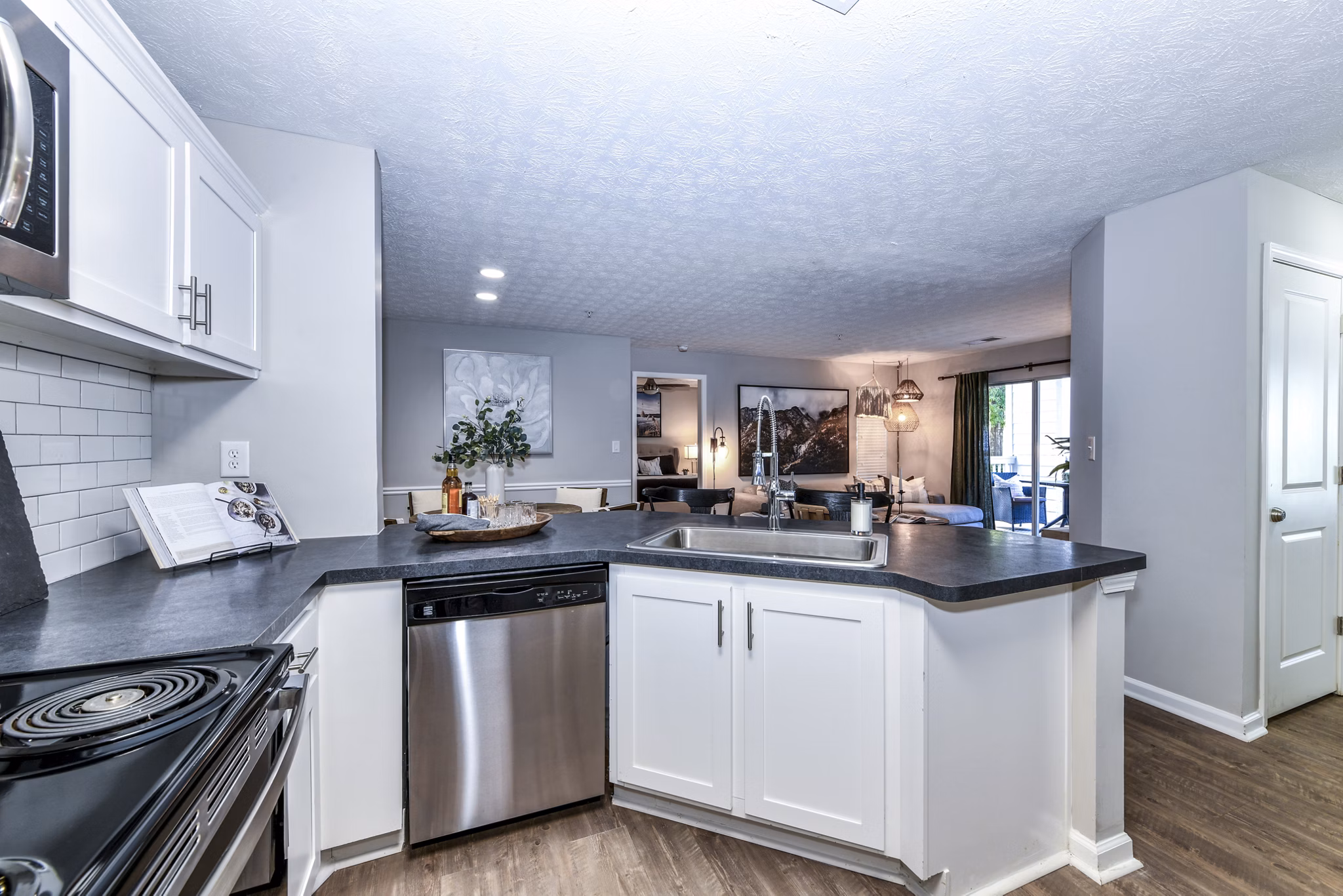 Modern kitchen with sleek cabinetry and stainless steel appliances at Avana Acworth Apartments