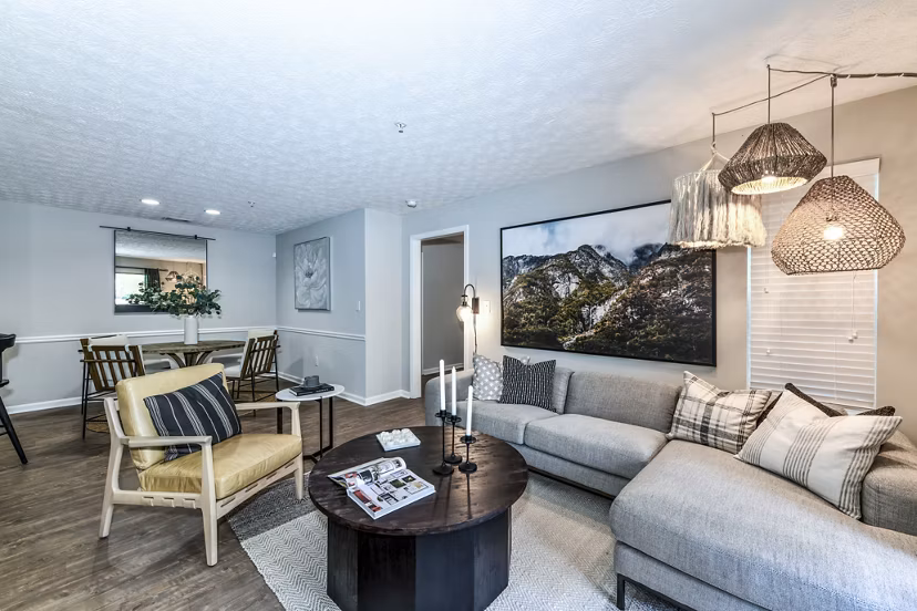 Cozy living room with modern furniture in Avana Acworth Apartments, featuring natural light and stylish decor