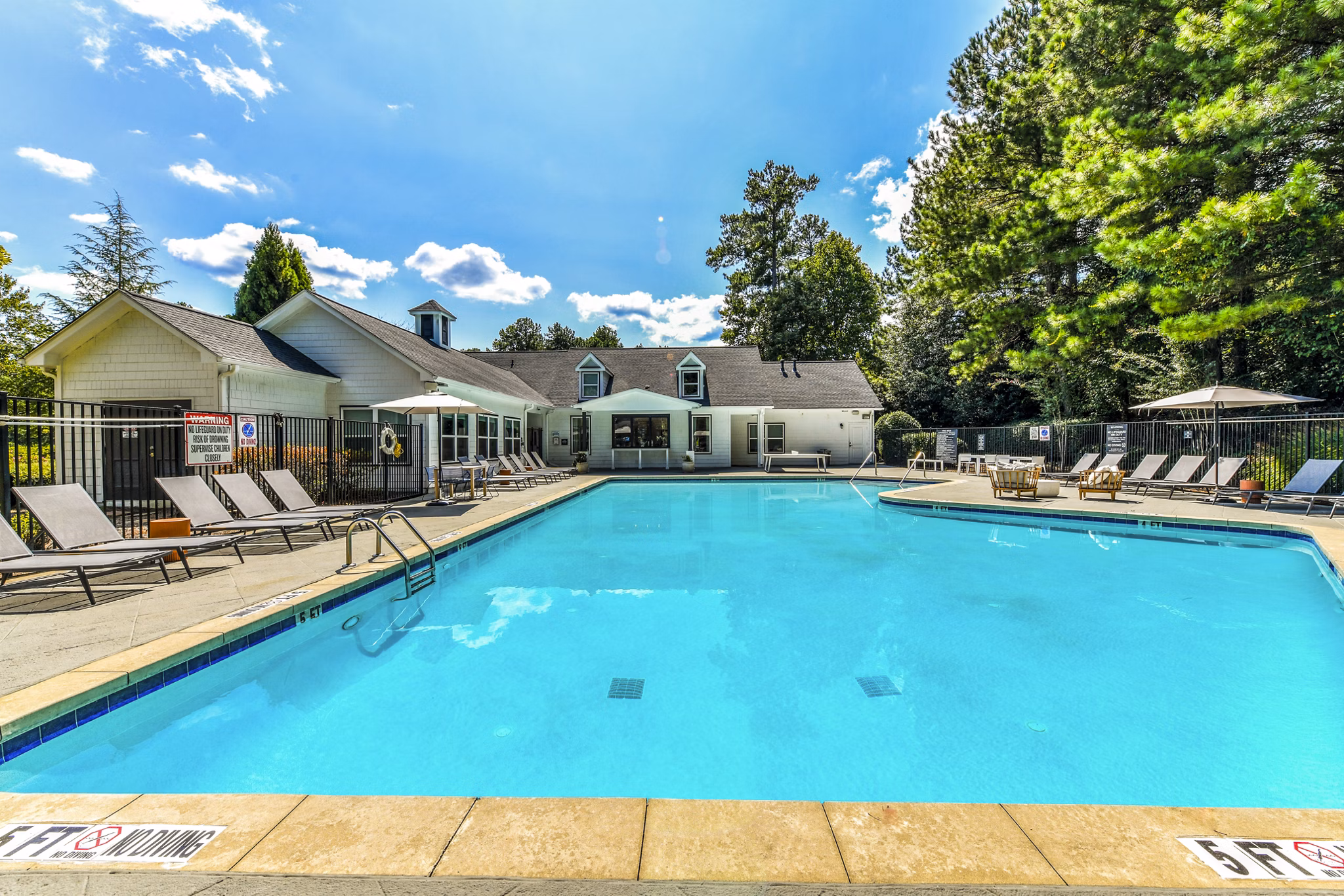 Resort-style pool with sun loungers at Avana Acworth Apartments