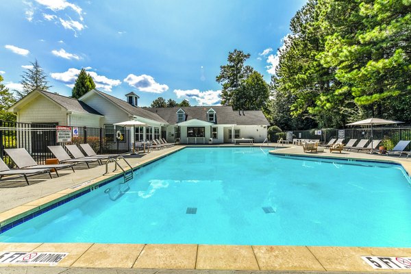Resort-style pool with sun loungers at Avana Acworth Apartments