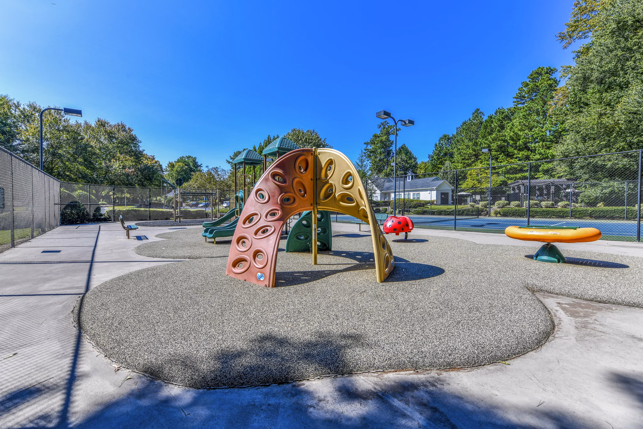 Playground area with colorful equipment at Avana Acworth Apartments for outdoor fun and recreation