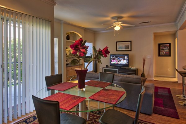 Dining room featuring modern decor and elegant lighting at Avana SoCo Apartments in luxury Greystar community
