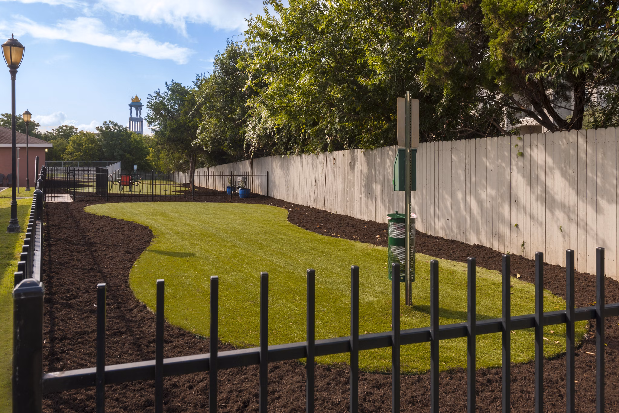 Expansive dog park with agility equipment at Avana SoCo Apartments