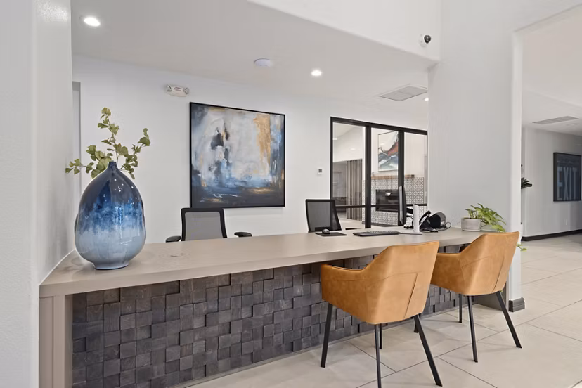 Contemporary clubhouse with modern furnishings at Solas Glendale Apartments, offering luxury amenities and spaces for social gatherings