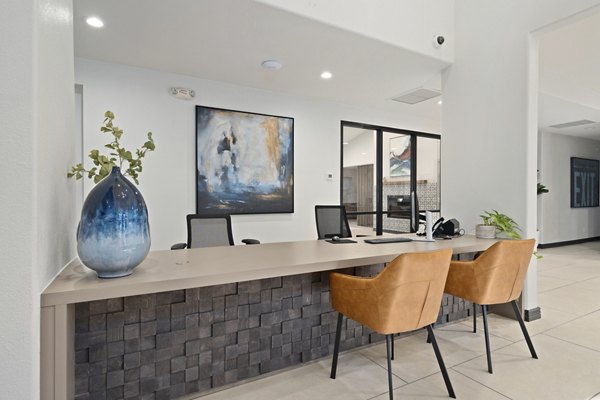 Contemporary clubhouse with modern furnishings at Solas Glendale Apartments, offering luxury amenities and spaces for social gatherings