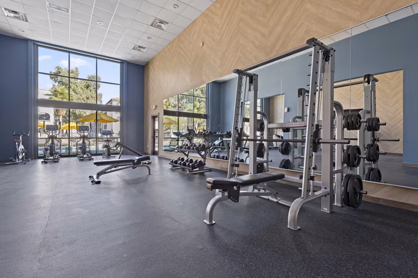 Fully-equipped fitness center at Solas Glendale Apartments with modern exercise machines for a luxurious workout experience