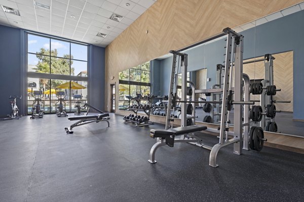 Fully-equipped fitness center at Solas Glendale Apartments with modern exercise machines for a luxurious workout experience