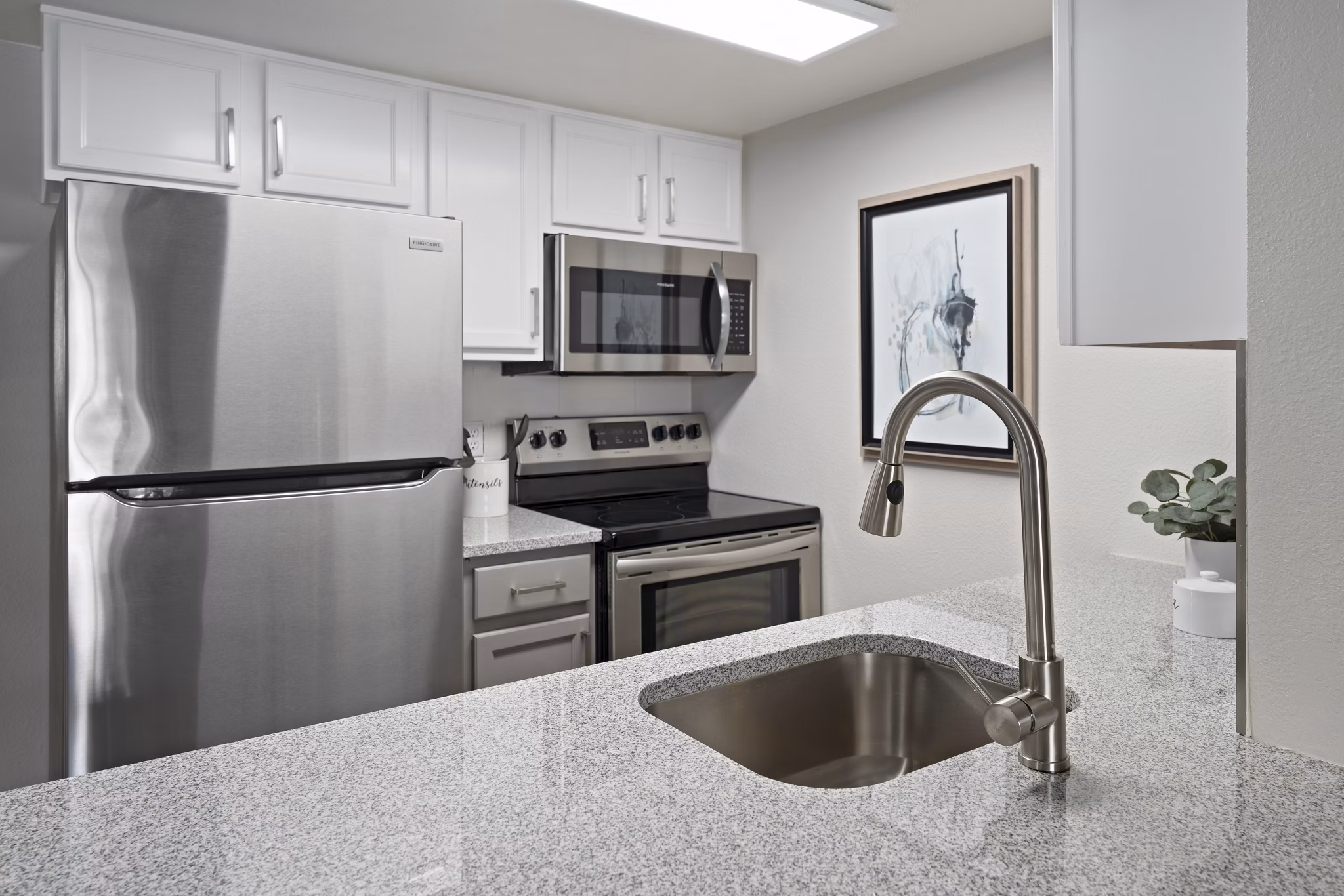 Modern kitchen with stainless steel appliances in Solas Glendale Apartments