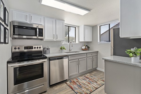 Modern kitchen with stainless steel appliances at Solas Glendale Apartments