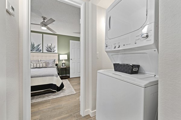 Modern laundry room with front-load washers and dryers at Solas Glendale Apartments