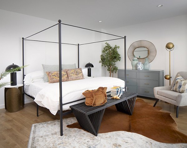 Modern bedroom with stylish furnishings and city view at Cielo Apartments