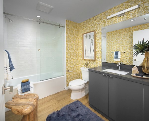 Cielo Apartments: Elegant bathroom with double vanity and marble accents in luxury Greystar community